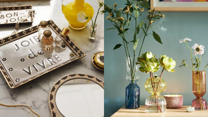 A gold and black tray that says joie de vivre and a set of three colorful glass vases 