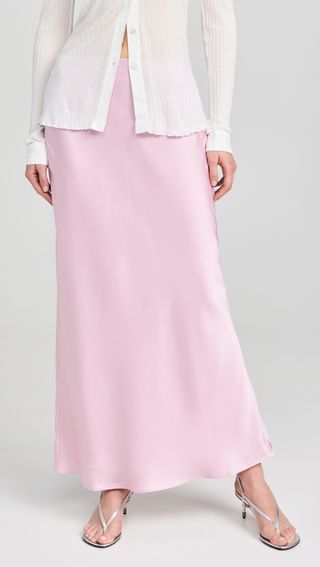 a model wears a maxi slip skirt in light pink