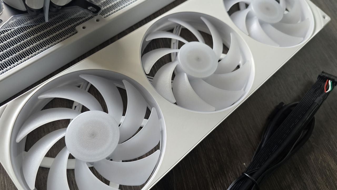 The NZXT Kraken Plus 360 RGB liquid cooler installed in a test bench.
