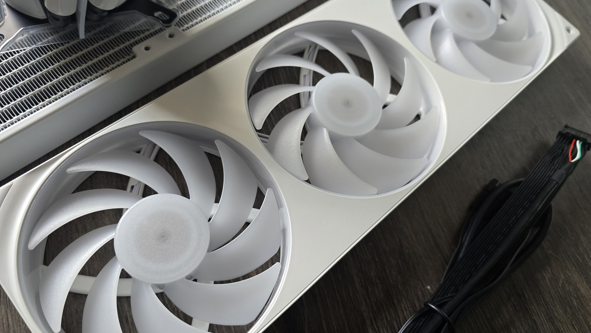 The NZXT Kraken Plus 360 RGB liquid cooler installed in a test bench.