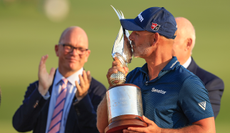 Paul Waring holds the Abu Dhabi HSBC Championship trophy