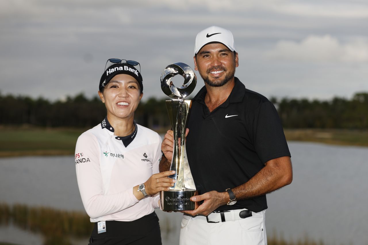 Lydia Ko and Jason Day hold the Grant Thornton Invitational trophy