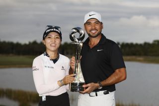 Lydia Ko and Jason Day hold the Grant Thornton Invitational trophy