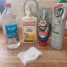 range of cleaning products including white vinegar sugar soap washing up liquid and ciff and a magic eraser