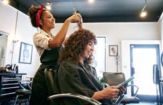 Woman at a salon having her hair cut