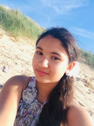 Arya Lloyd on a beach