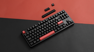 The Keychron C3 Pro mechanical keyboard against a black and red background.