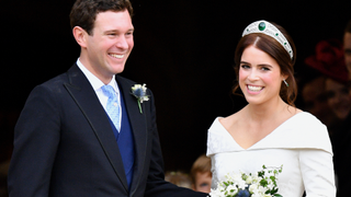 Jack Brooksbank and Princess Eugenie leave St George's Chapel after their wedding ceremony on October 12, 2018 in Windsor, England