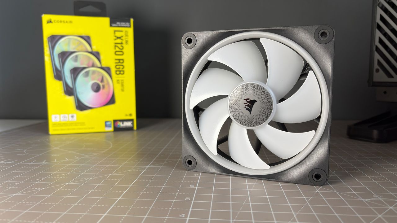 Various PC fans on a table with testing equipment for a round of batch tests.