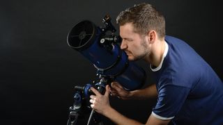 Man using one of the best telescopes for beginners