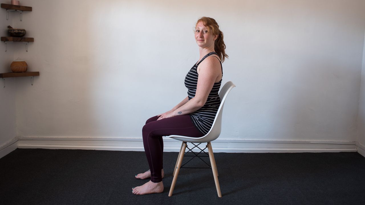 desk exercises: seated woman with head turned to the left