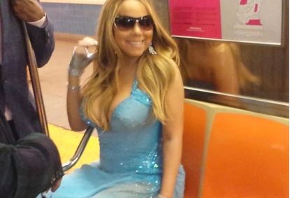 Mariah Carey rides the NYC subway in a floor-length gown
