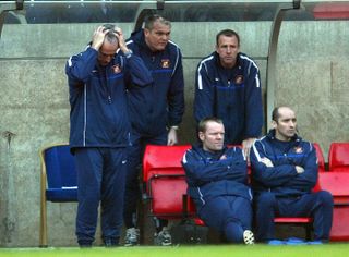 Mick McCarthy (left) holds his head in his hands during Sunderland's record losing run
