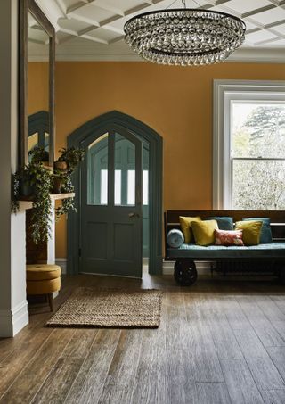 An entrance with a warm yellow paint on the walls