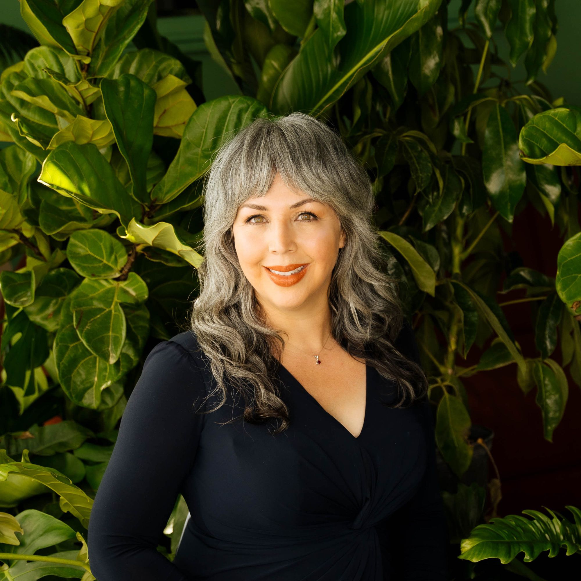 A headshot of Adriana Green Thompson