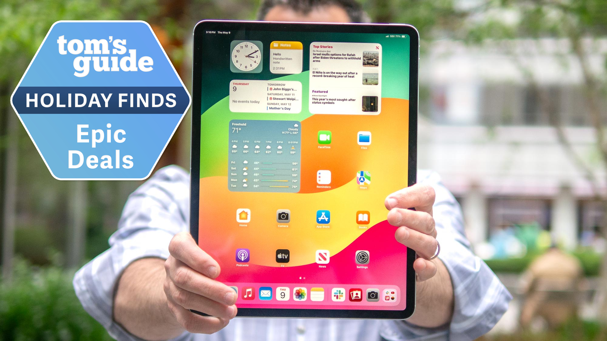 Apple iPad held up with holiday finds deal tag superimposed