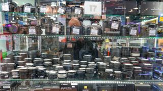 3DG537J HONG KONG, CHINA - NOVEMBER 3, 2025: Lenses in a window of photo equipment shop in Sim City mall specializing in photography equipment in Kowloon