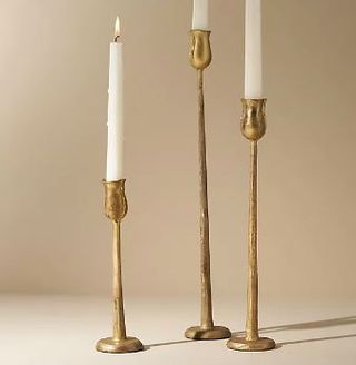 Three golden candlesticks