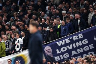 Chelsea manager Mauricio Pochettino in front of a banner dedicated to Ange Postecoglou during the Blues' 4-1 win at Tottenham in November 2023.