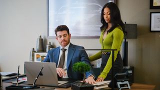 Rick Dodson (Bryan Greenberg) and Erica Rollins (Lex Scott Davis) look at a computer in "Suits LA" episode 101