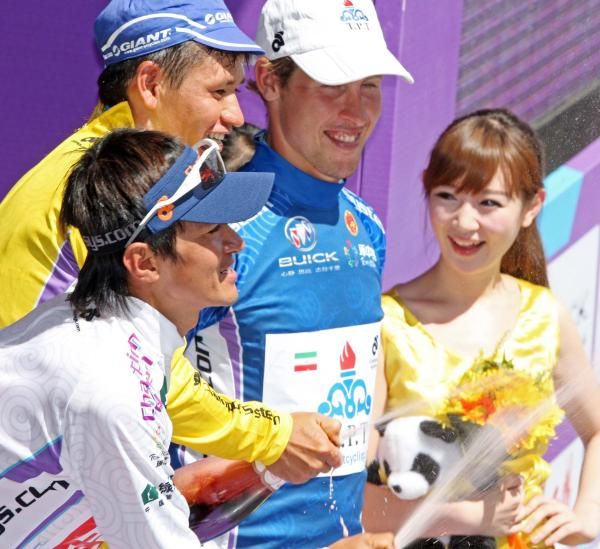 Overall leader Halmuratov standing on the podium.