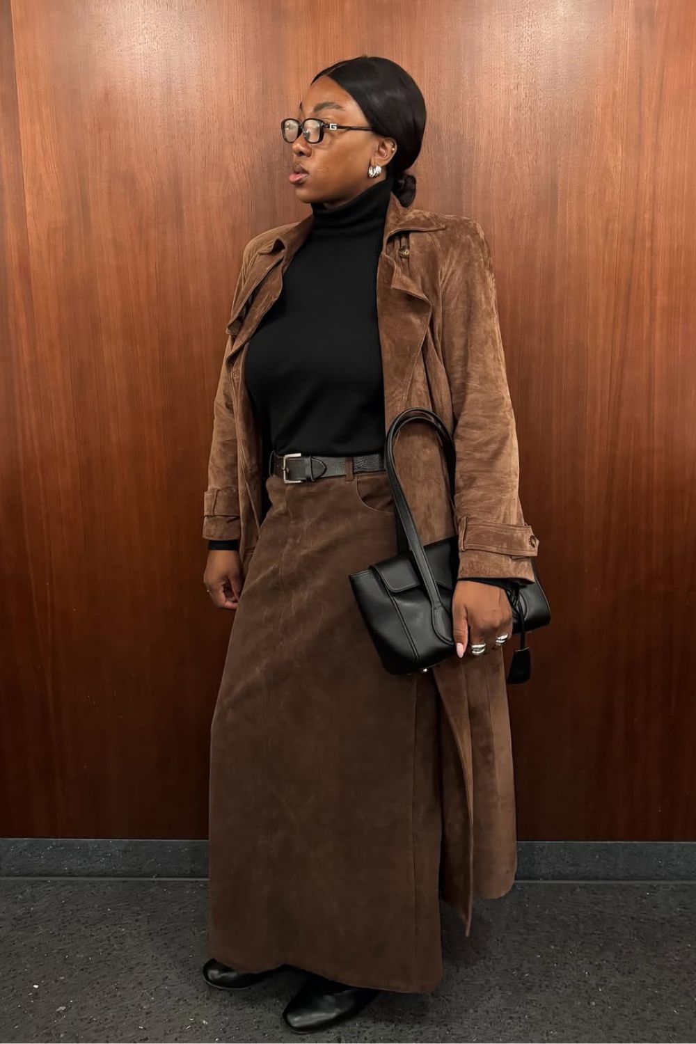 @nnennaechem Petite Fashion Trends Winter 2025 wearing a black roll neck and suede pencil skirt