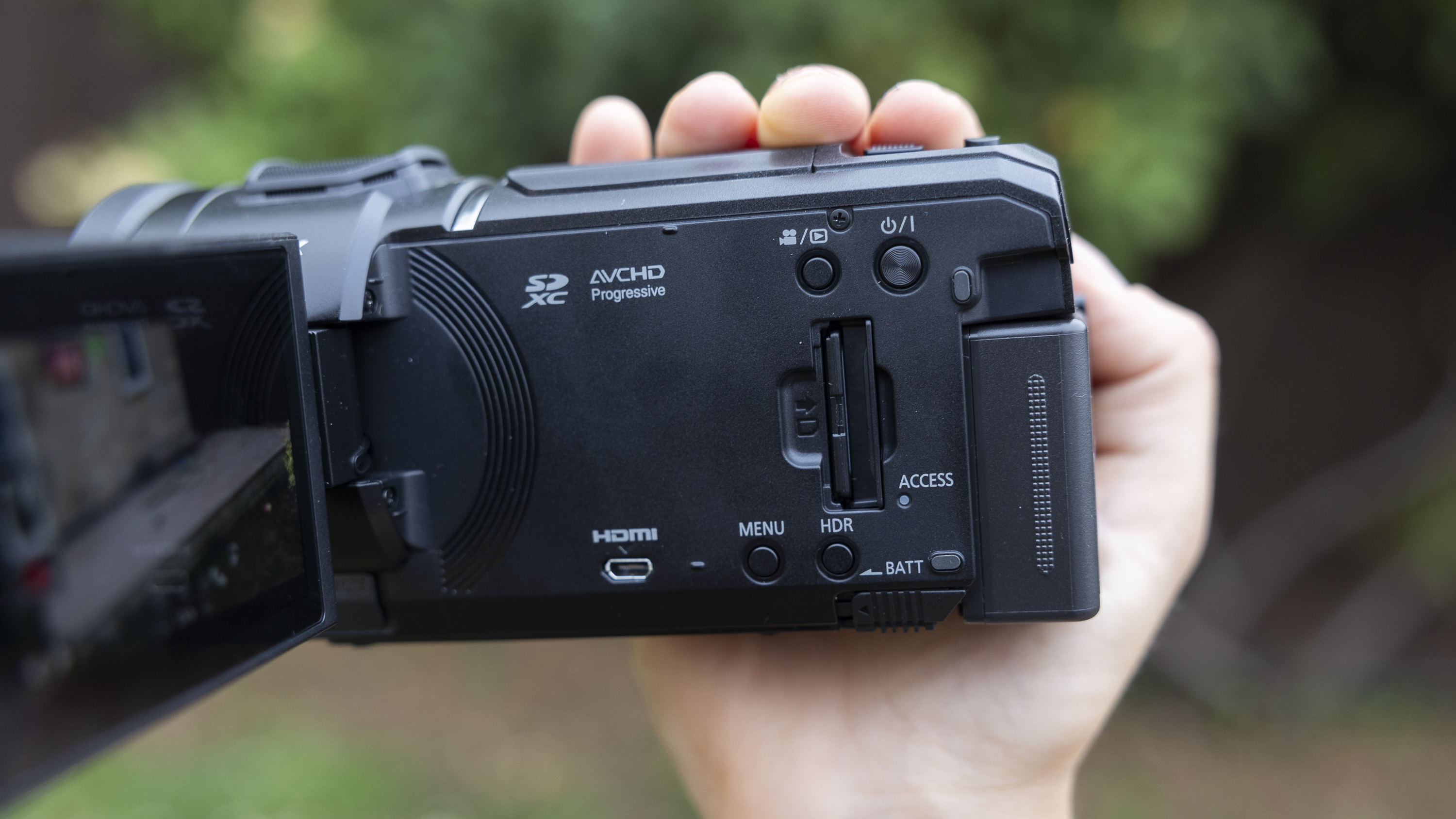 A side view of the Panasonic HC-V900 camcorder and ports