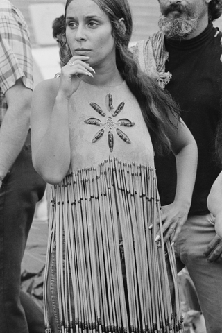 A woman in a beaded and fringed suede vest at the Woodstock music festival in Bethel, New York State, August 1969.