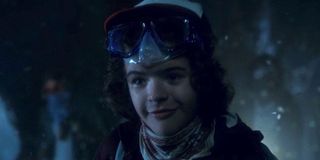 Dustin speaking with Dart in The Upside Down tunnels