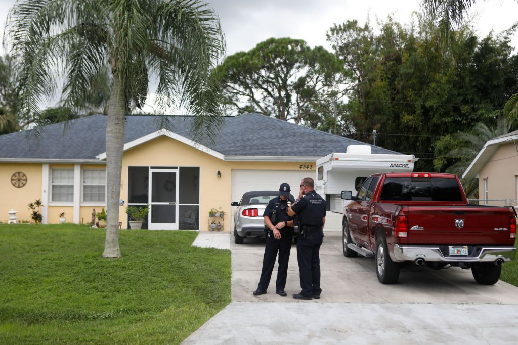 Police officers stand outside of Brian Laundrie&amp;#039;s home.