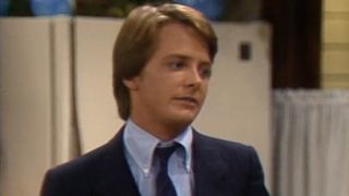 Michael J. Fox close up looking slightly concerned in Family Ties.