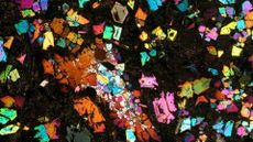 A kaleidoscope of colors is seen against a black background