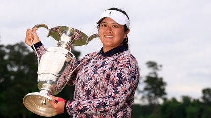Lilia Vu holds up the Chevron Championship trophy after her victory in 2023