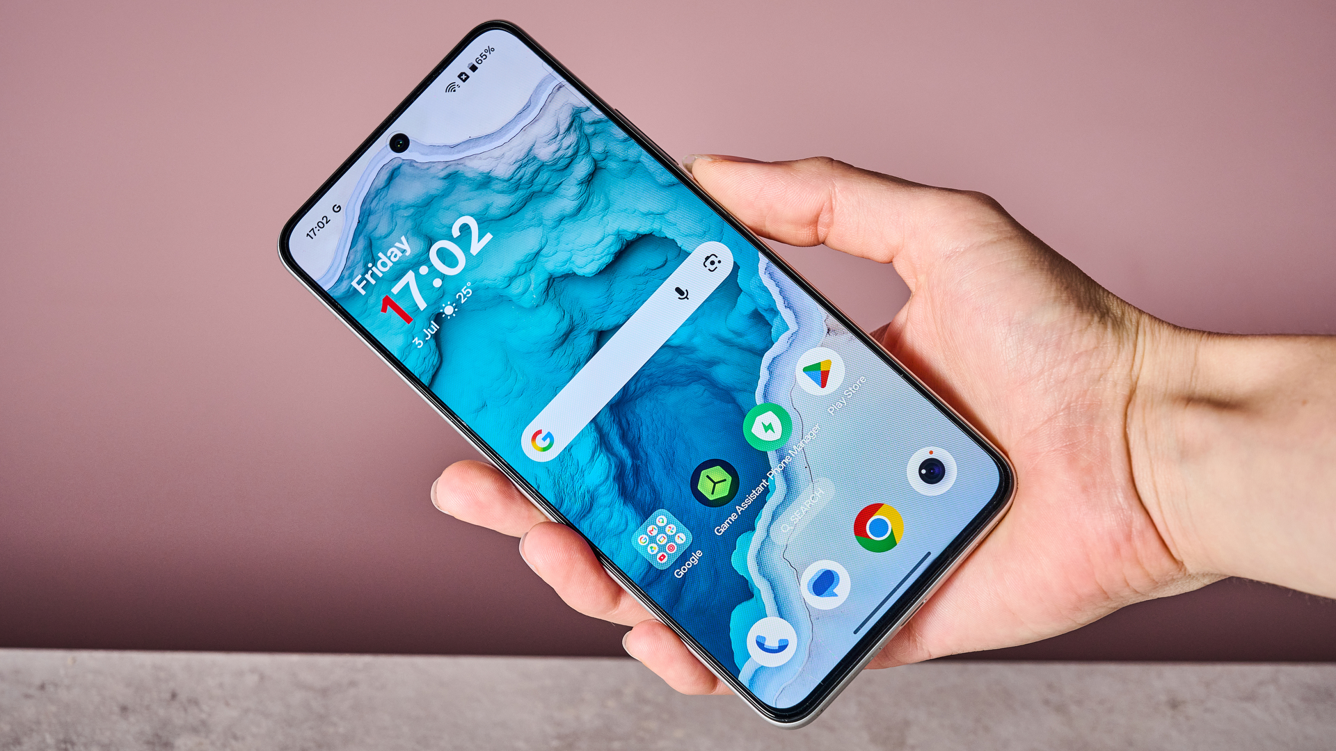A woman's hand showing off the unlocked OnePlus Nord CE5's home screen.