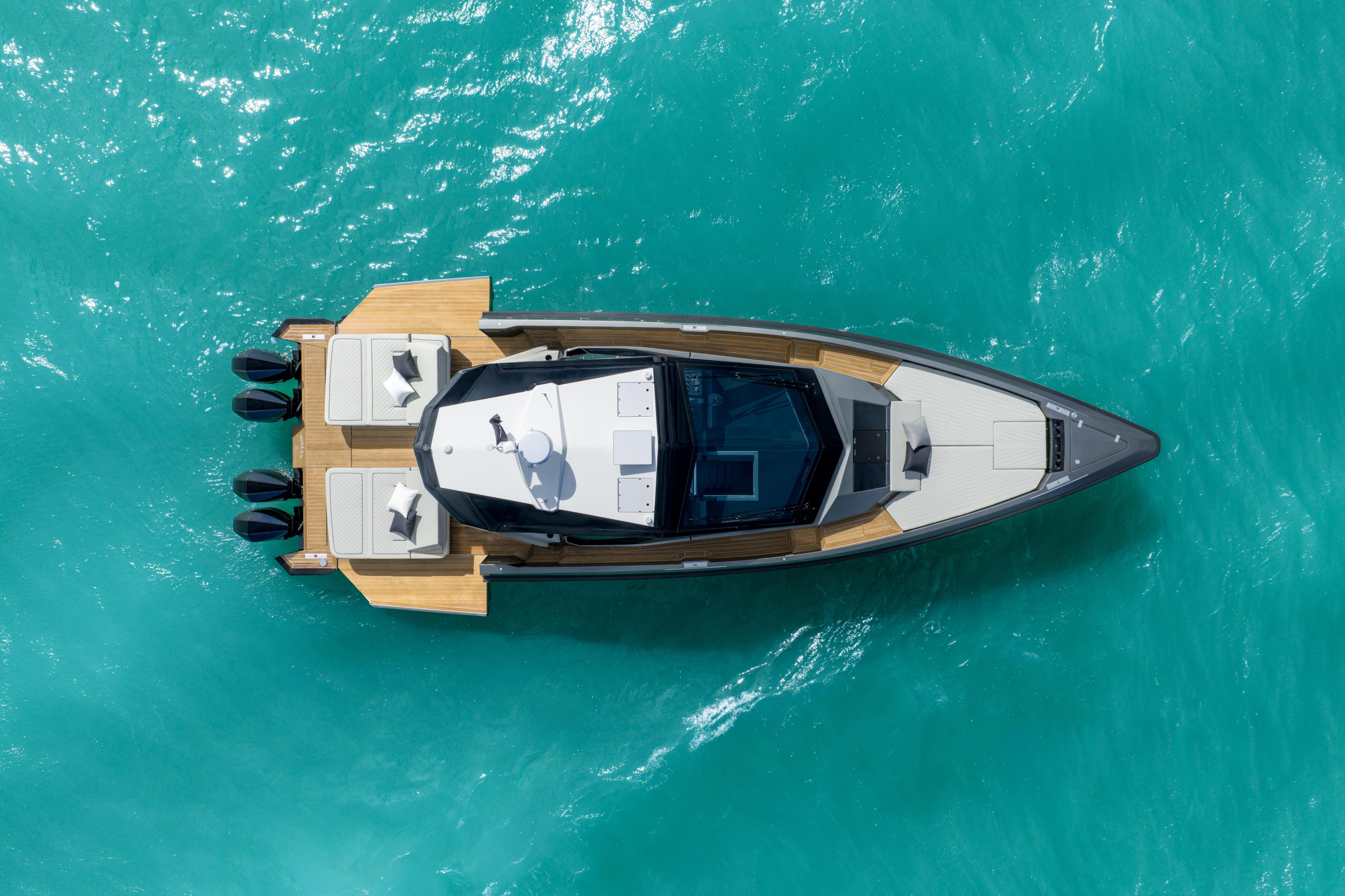 wallypower50X at anchor, showing the folding transoms that extend the rear deck