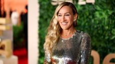 a smiling headshot of SJP on the red carpet