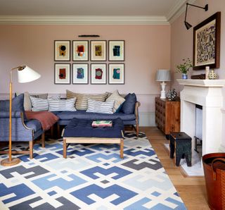 pink living room with dark blue couch