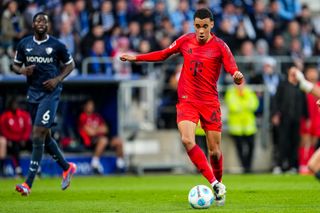 BOCHUM, GERMANY - OCTOBER 27: Jamal Musiala of FC Bayern Munchen dribbles with the ball during the Bundesliga match between VfL Bochum 1848 and FC Bayern Munchen at Vonovia Ruhrstadion on October 27, 2024 in Bochum, Germany. (Photo by Rene Nijhuis/MB Media/Getty Images)