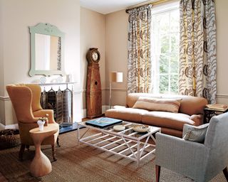 A living room with brown sofa idea with light brown sofa and pale neutral accessories