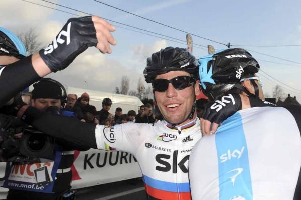 Hugs all around for Mark Cavendish (Sky) at the finish.