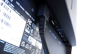 Gigabyte M28U gaming monitor pictured on a desk