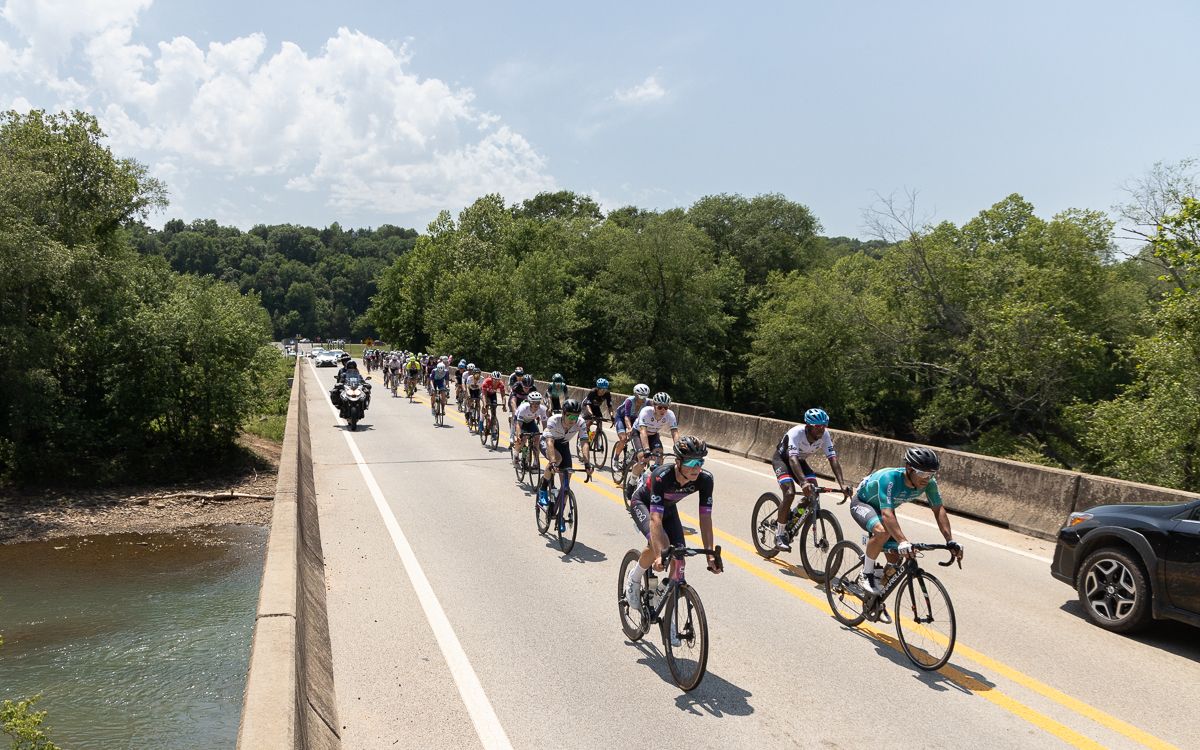 The bulk of the men's peloton remained together over Frog Bayou that runs through Rudy, Arkansas.