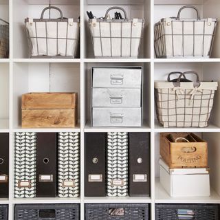 Shelves with storage baskets and labelled drawers and files