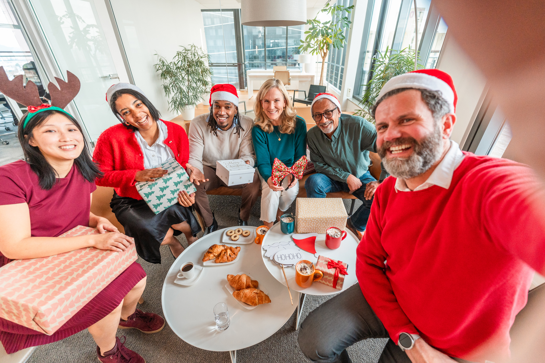 Coworkers taking a selfie at their holiday party