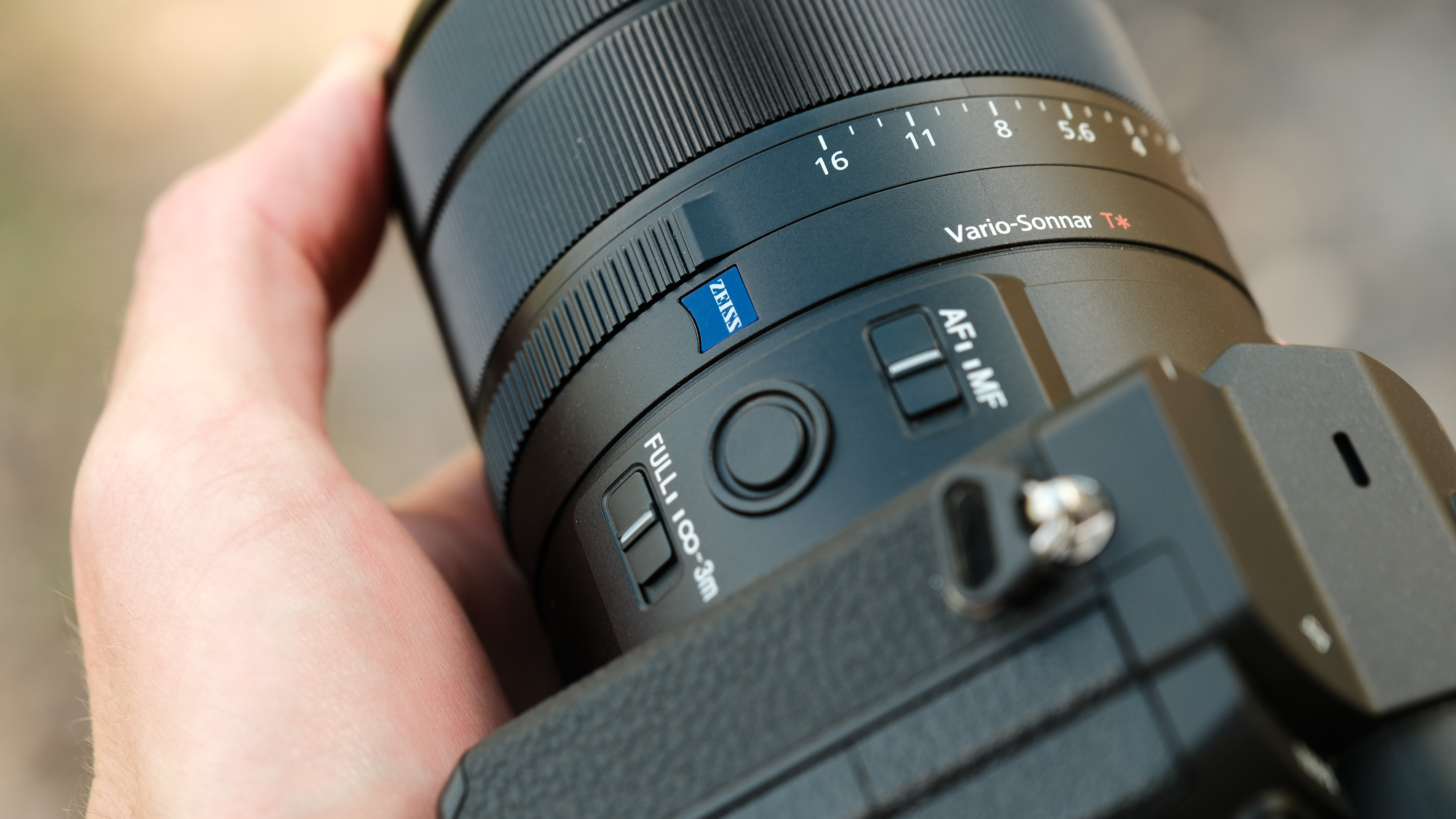 Close-up of the Sony RX10 V Zeiss lens, aperture ring, focus switch, and focus limiter controls.