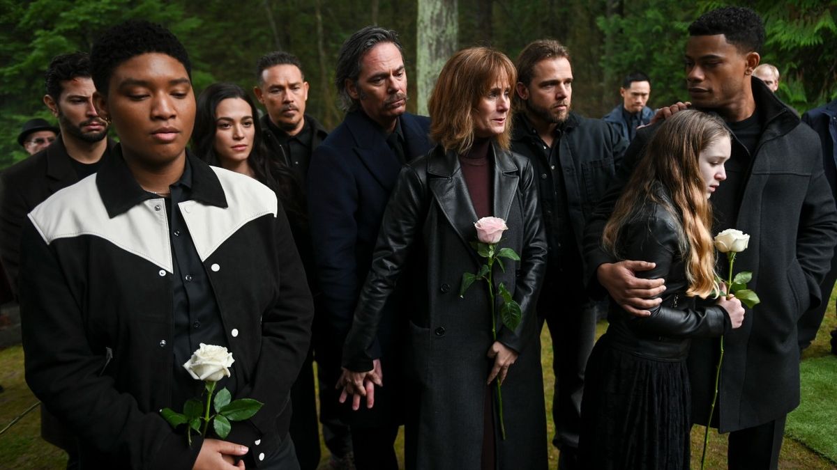 Pictured: Rafael De La Fuente as Diego Moreno, Jules Latimer as Eve Edwards, Stephanie Arcila as Gabriela Perez, Kevin Alejandro as Manny Perez, Billy Burke as Vince Leone, Diane Farr as Sharon Leone, Max Thieriot as Bode Leone, Alix West Lefler as Genevieve, Jordan Calloway as Jake Crawford as Cara&#039;s funeral in Fire Country.