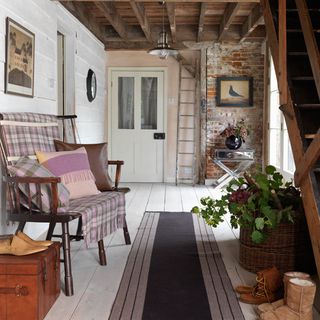 hallway with bench and wool blanket