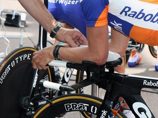 Rabobank's custom time trial bottles and cages are designed so that the rider doesn't have to break his tuck to take a drink