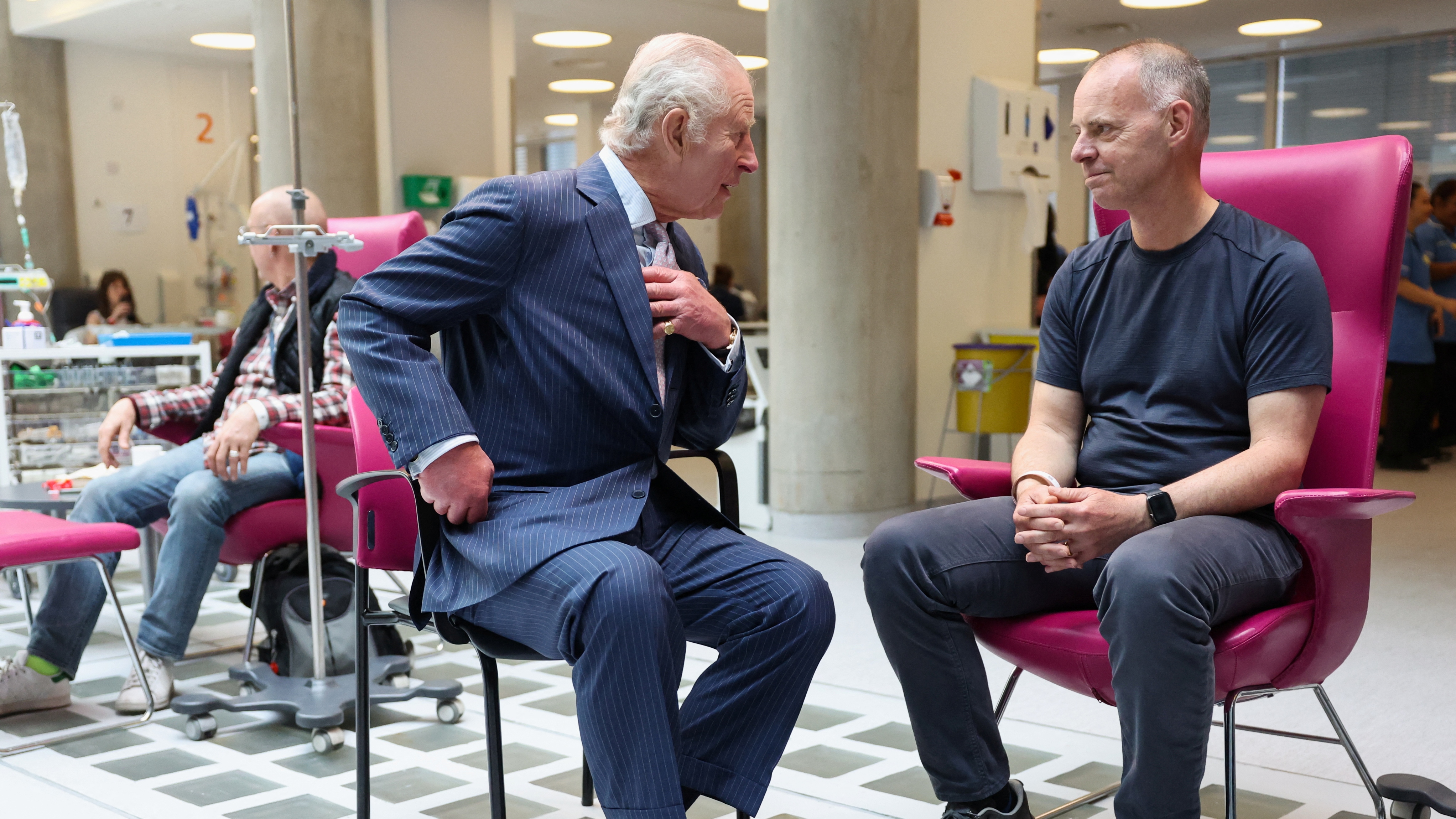 King Charles III meets with patient Huw Stiley during a visit to the University College Hospital Macmillan Cancer Centre on April 30, 2024