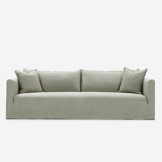 sage green slipcover sofa